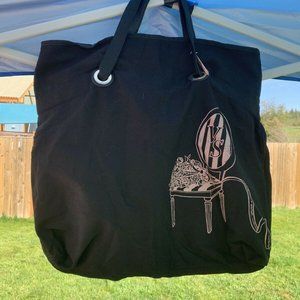 Victoria’s Secret black tote bag with pink chair and bouquet